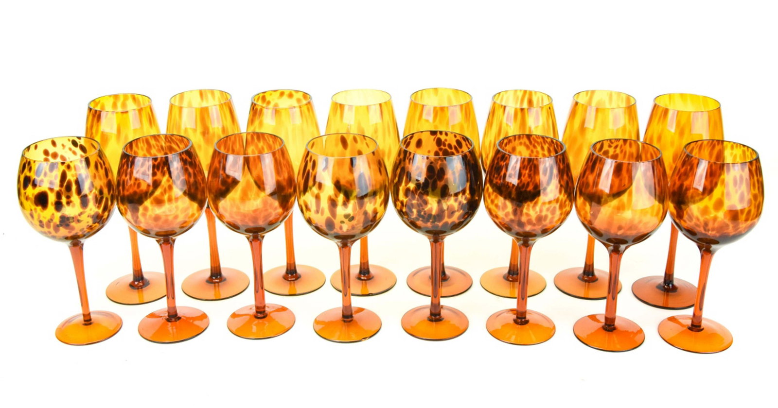 16 Hand Blown Tortoise Shell Wine Glasses: 16 Hand Blown Tortoise Shell Pattern Red and White Wine Glasses. 8 white and 8 red wine stemmed wine glasses. 2 white wine glasses have a chip on each at base. White wine glass measures 10 inches x 4 
