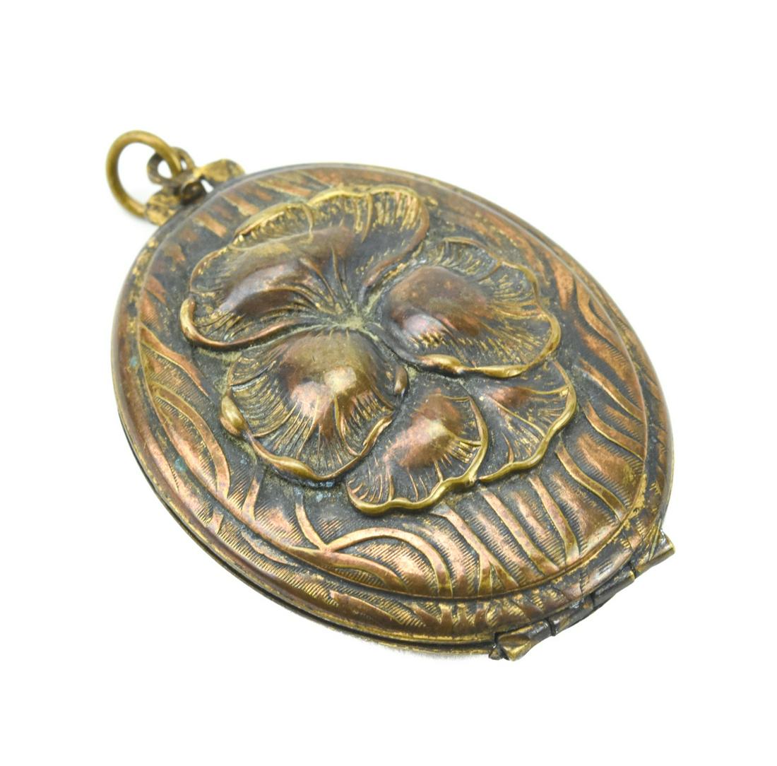 Antique Locket Pendant w Pansy Flower Design: Antique Locket Necklace Pendant w Repousse Pansy Flower Design. Measures 2.25 inches in length.