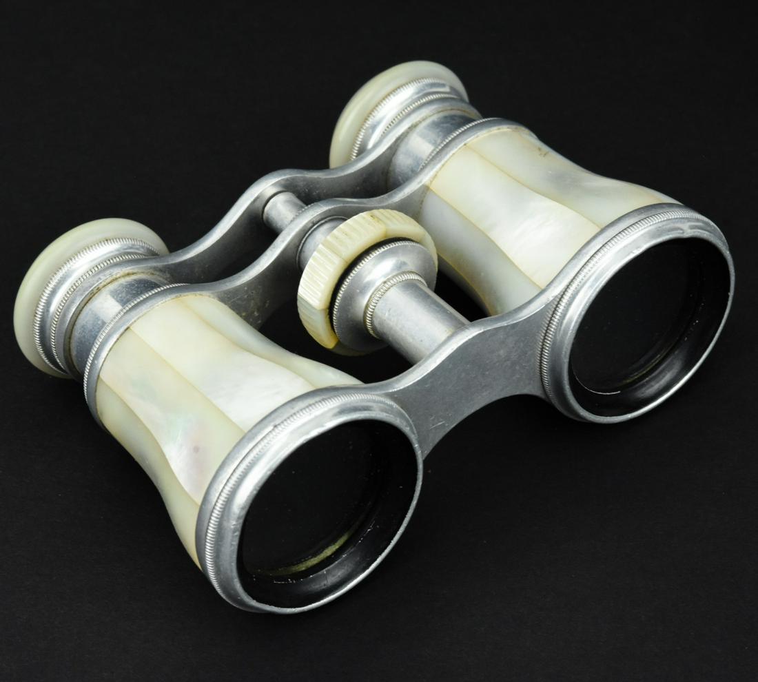 Antique French Mother of Pearl Opera Glasses: Antique French Mother of Pearl Opera Glasses by Lemaire Fi Paris. Measures 4 inches in width.