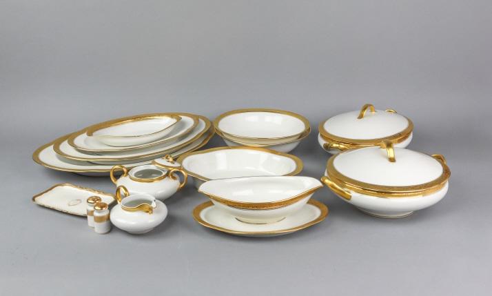 Antique Limoges Gold Rimmed Serving Pieces: Antique Limoges Gold Rimmed Porcelain Serving Pieces. Includes 4 graduated platters, 3 serving bowls, 2 tureens, gravy boat, cream and sugar, salt and pepper, and trinket dish. Largest platter measure