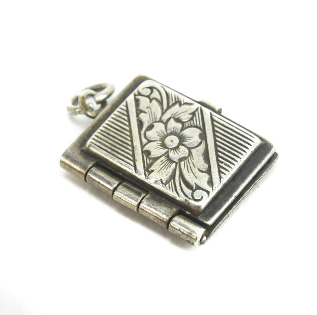 Vintage Sterling Silver Book Form Locket Pendant: Vintage Sterling Silver Book Form Locket Pendant. Measures just over .75 of an inch in length.