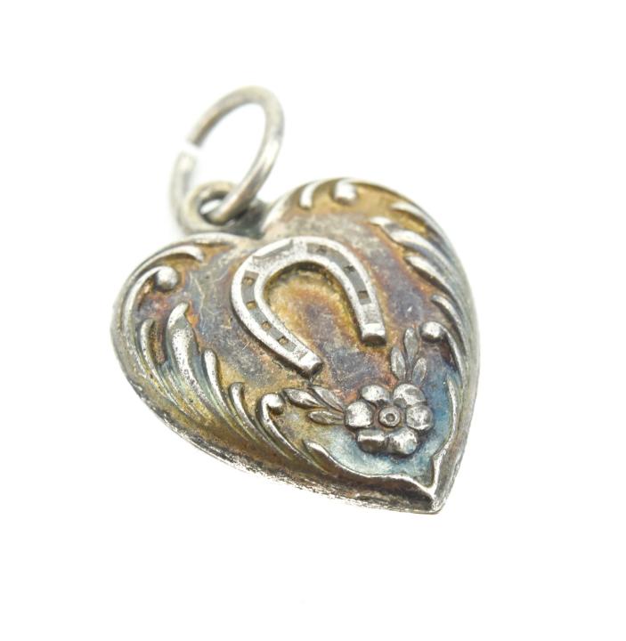 Antique Sterling Horse Shoe Heart Pendant: Antique Sterling Silver Equestrian Motif Horse Shoe Heart Pendant. Measures .75 of an inch in length.