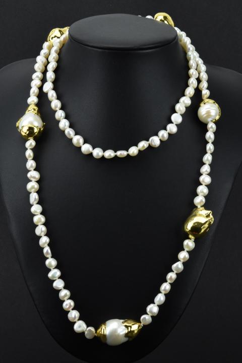 Hand Knotted Baroque Pearl & Gold Plated Necklace: Hand Knotted Baroque Pearl & Gold Plated Necklace. Hand knotted on white silk thread with high luster baroque pearls. Measures 36 inches in length.