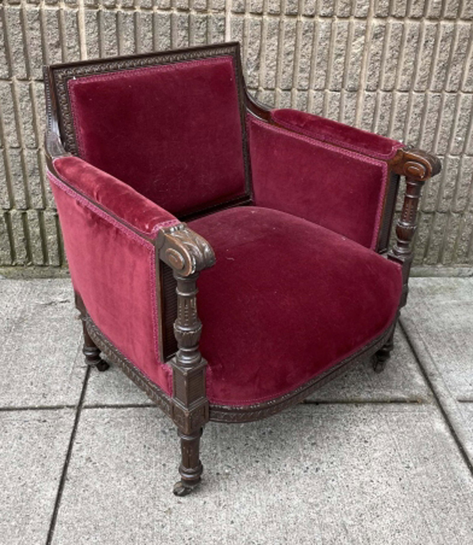 Antique Louis XVI Velvet Upholstered Armchair: Antique Louis XVI Style Velvet Upholstered Armchair on Castors. Measures 31 inches x 29.75 inches x 25 inches x 13 inches from floor to seat.