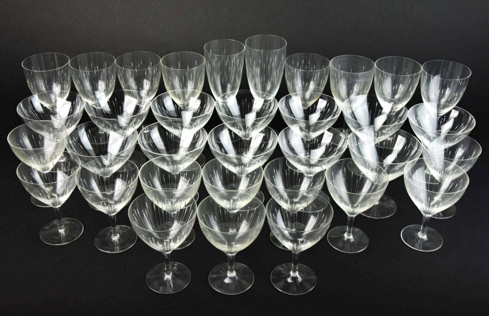 Rosenthal Mid C Modern Etched Crystal Glassware: Rosenthal Mid Century Modern Etched Crystal Glassware. Includes 12 large champagne coupes, 12 small champagne coupes, 8 wine glasses, 2 longer stem wine glasses.