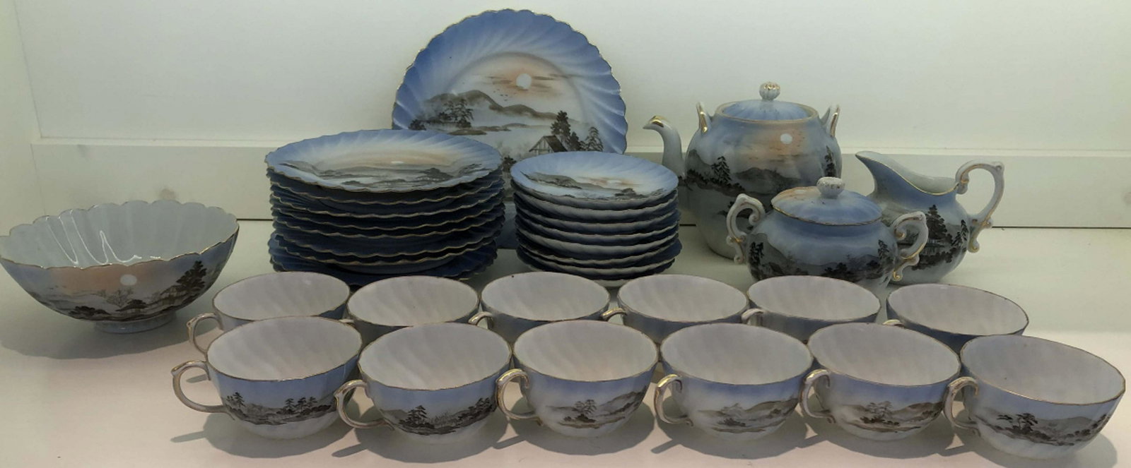 Antique Chinese Bone China Hand Painted Tea Set: Antique Chinese Bone China Hand Painted Tea Set. Service for 8 includes 9 cakes plates, 10 tea cups, 8 saucers, 2 serving dishes, 1 serving bowl, tea pot, sugar and creamer. Serving dishes measure 7 i