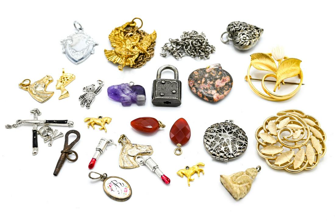 Collection of Antique & Vintage Jewelry Pieces: Collection of Antique & Vintage Jewelry Pieces. Including signed costume jewelry by Trifari, charms, pendants brooch / pins