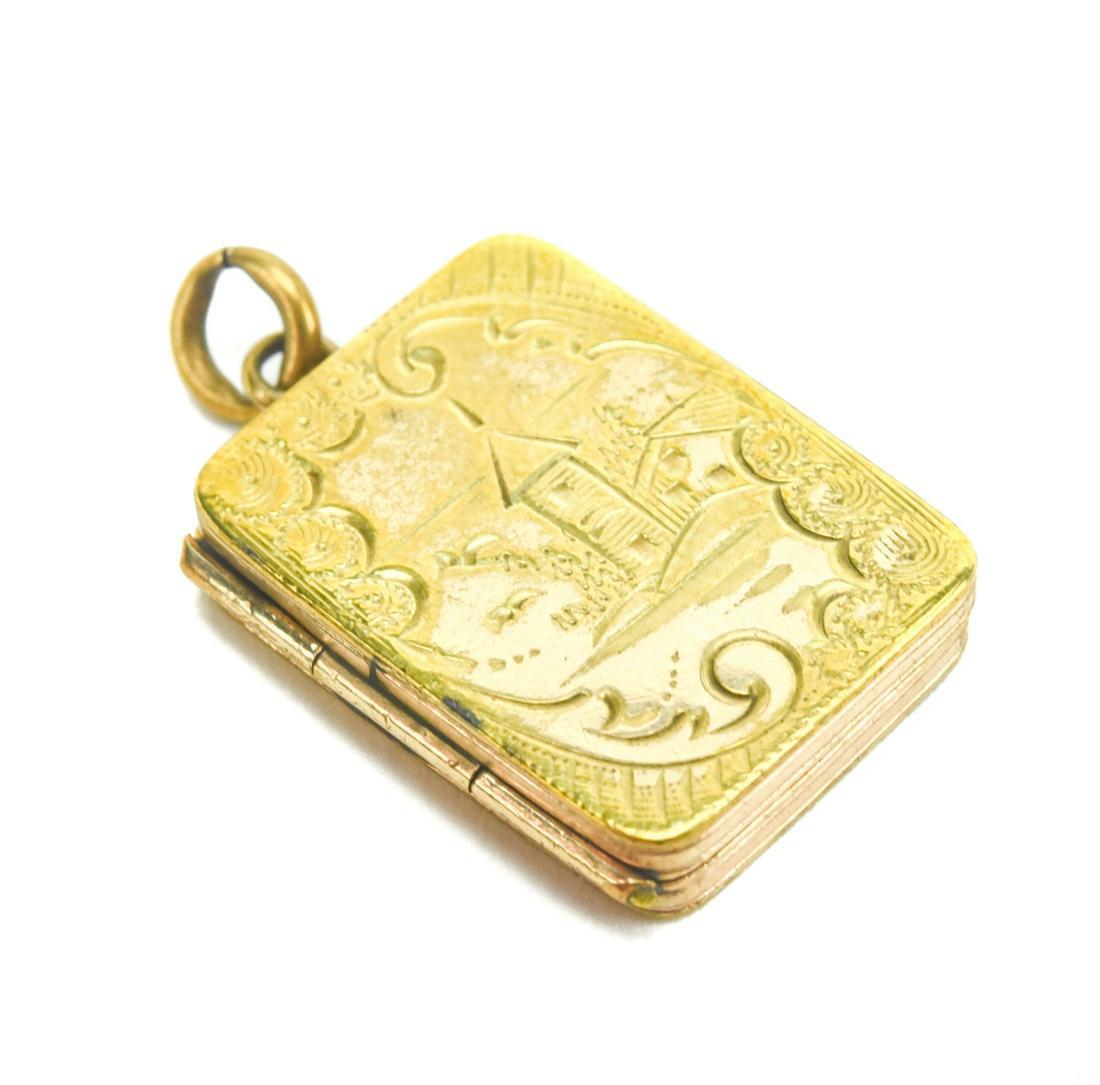 Antique 19th C Gold Filled Locket Necklace Pendant: Antique 19th C Gold Filled Locket Necklace Pendant. Front with scene of a castle. Measures just over 1 inch in length.