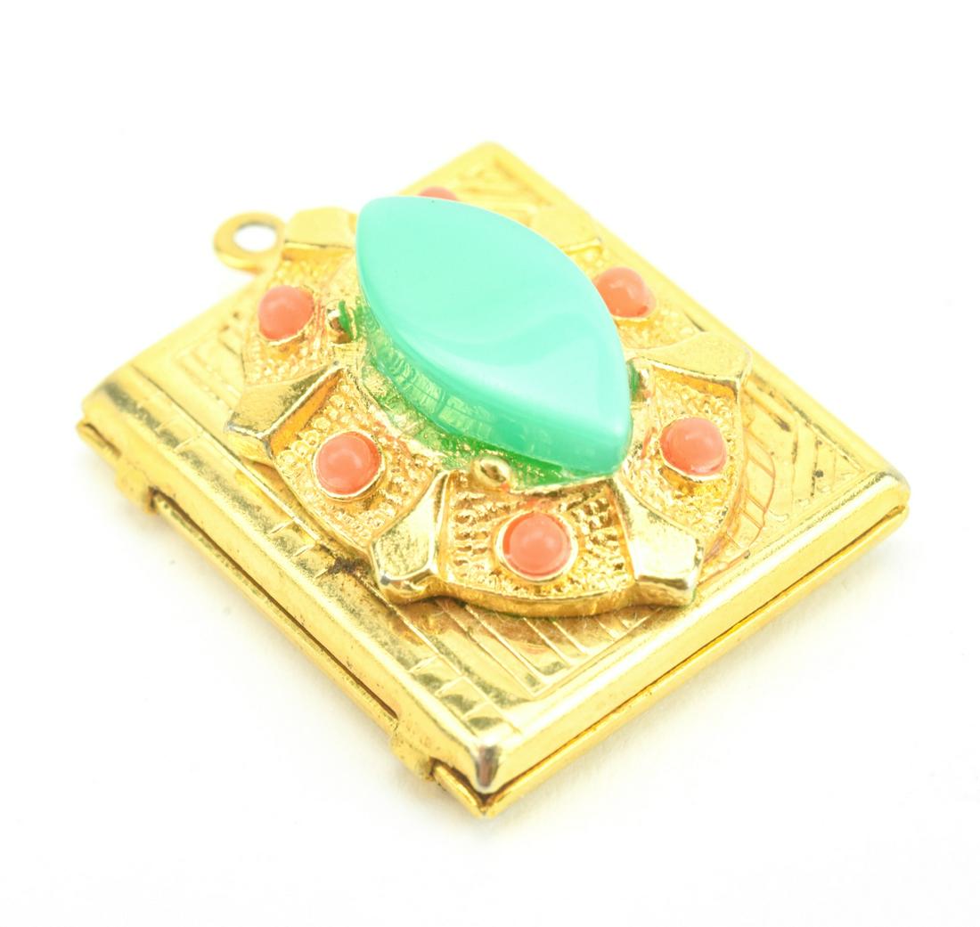 Vintage Costume Jewelry Book Form Locket Pendant: Vintage Costume Jewelry Book Form Locket Pendant. Gilt metal locket necklace pendant with faux turquoise and faux coral. Measures just over 1 inch in length.