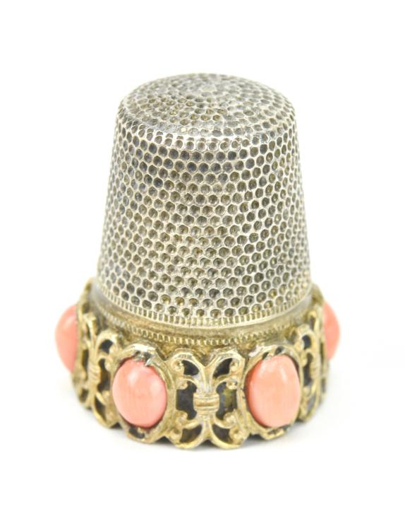 Antique Sterling & Coral Cabochon Sewing Thimble: Antique Sterling & Coral Cabochon Sewing Thimble. Measures just over .75 of an inch in height.