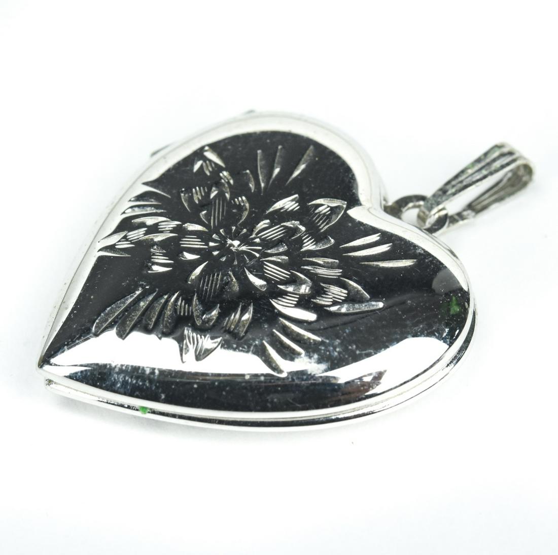 Sterling Silver Heart Form Locket Necklace Pendant: Sterling Silver Heart Form Locket Necklace Pendant. Hallmarked. Measures nearly 1.5 inches in length.