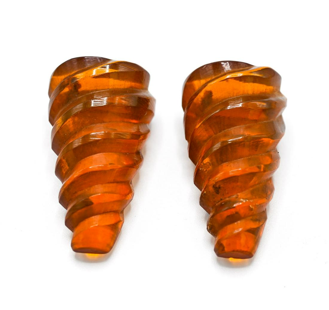 Pair of Vintage Carved Bakelite Clips: Pair of Vintage Costume Jewelry Carved Bakelite Clips. Each measures 1.5 inches in length. Faux amber