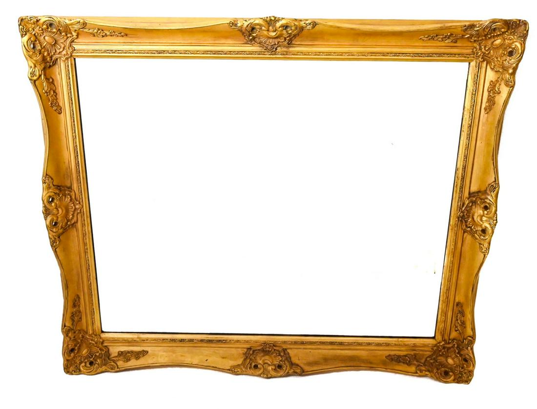 Gilt Rococo Beveled Glass Mirror: Gilt Rococo Beveled Glass Mirror. Measures 40 inches x 32 inches.