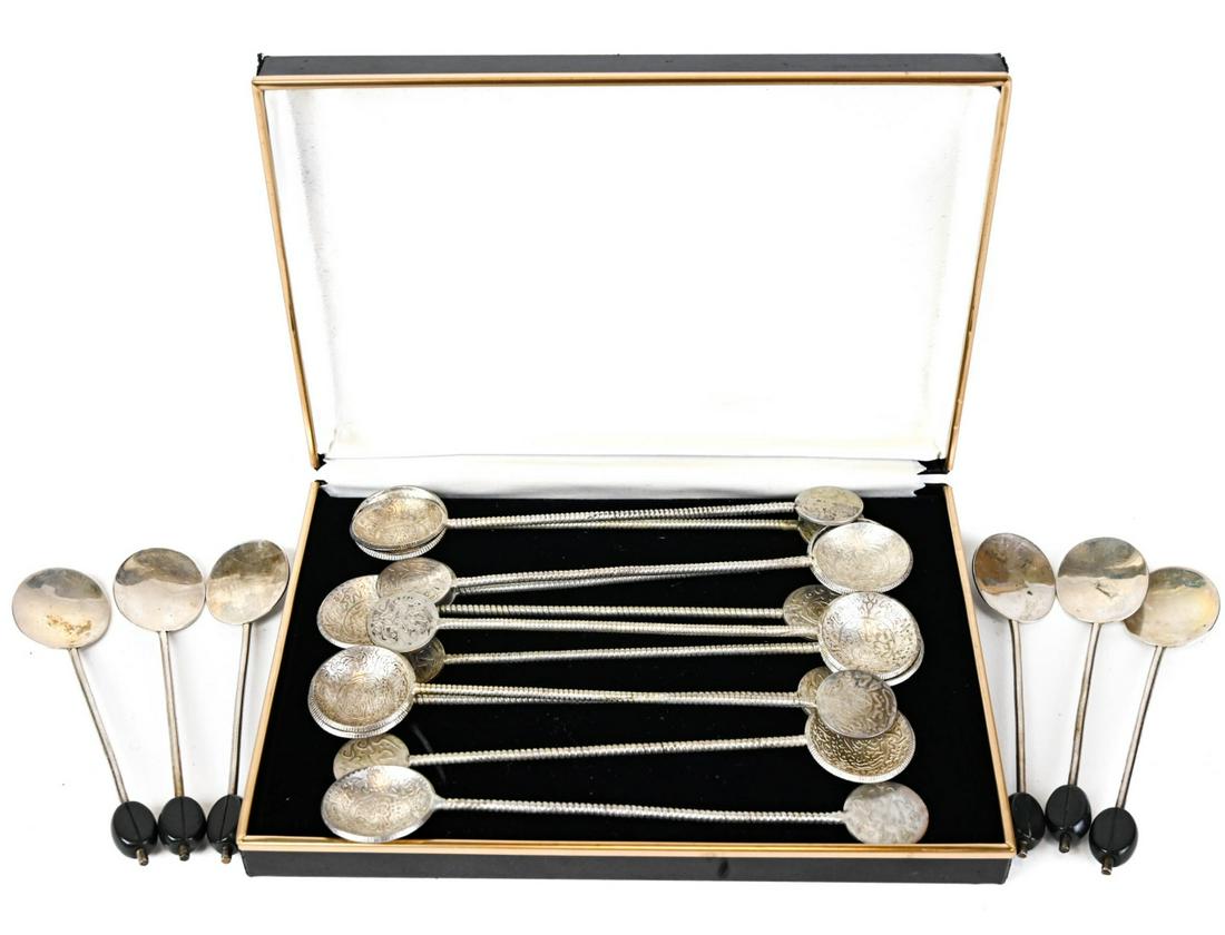 Sterling Silver and Silver Plated Espresso Spins: Sterling Silver and Silver Plated Espresso Spins. 6 Sterling bakelite coffee handle and 11 Mexican silver plated coffee spoons. Measures 4.5 inches.