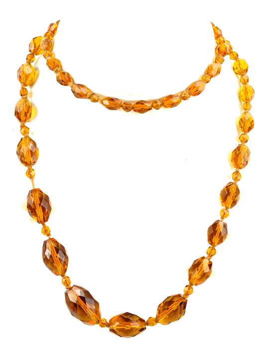 Antique Art Deco Flapper Citrine Glass Necklace: Antique Art Deco Flapper Era Hand Knotted Citrine Glass Necklace. Graduated size beads. Measures nearly 32 inches in length.