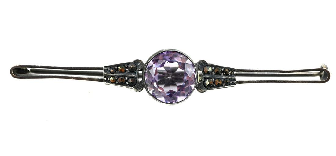 Antique Edwardian Sterling Amethyst Marcasite Pin: Antique Edwardian Sterling Silver Amethyst Marcasite Brooch. Measures 3 inches in length.