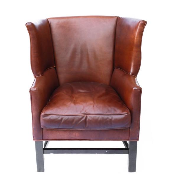 Brown Leather Wingback Chair: Brown Leather Wingback Chair. Measures 41 inches x 33 inches x 32 inches.