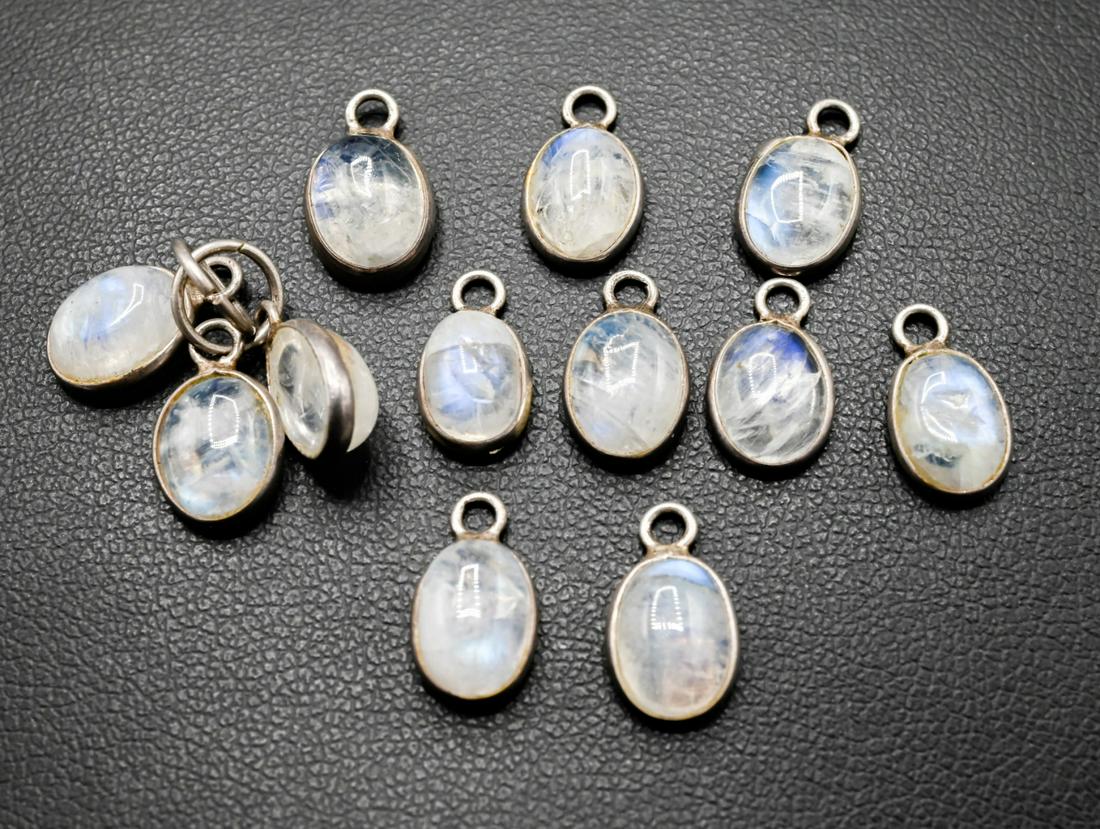 Collection of Sterling & Moonstone Cabochon Charms: Collection of Sterling Silver & Moonstone Cabochon Necklace Pendants or Charms. Under 1/2 an inch in length.