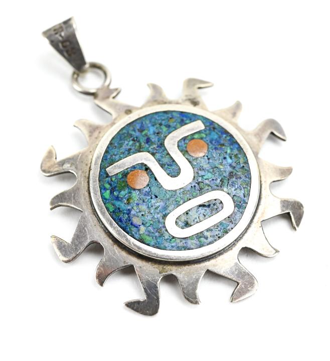 Native American Sterling Turquoise Pendant: Native American Style Sterling Turquoise Necklace Pendant. Starburst design. Measures 1.75 inches in length. Hallmarked and stamped MEXICO.