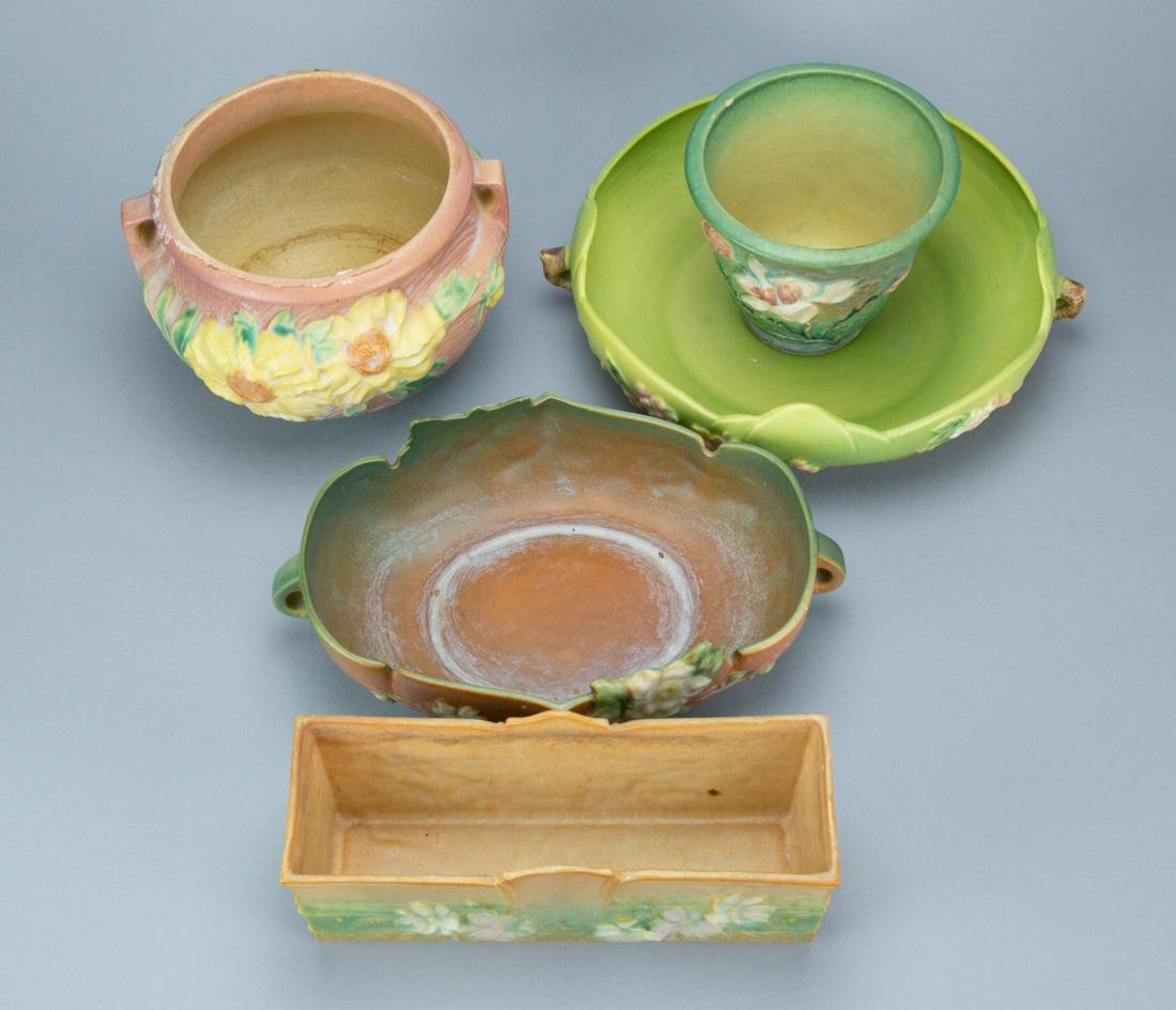 Antique Roseville American Pottery Collection: Antique Roseville American Pottery Collection, Includes Bush Berry Vase, Magnolia Vase, Magnolia Bowl,Cosmos Planter and Apple Blossom Vase.Largest measures 6 inches x 9 inches diameter.