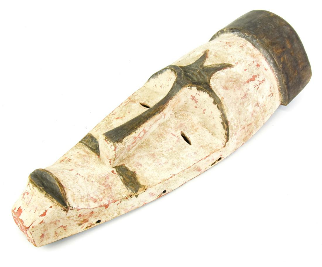 African Fang Tribe Ngil Protection Mask: African Fang Tribe Hand Carved & Painted Ngil Protection Mask. From the Fang people, Gabon, Central Africa. Measures 24 inches x 9 inches x 5.5 inches.