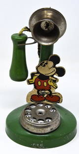 Vintage Mickey Mouse Candlestick Phone: Vintage Mickey Mouse Candlestick Phone - Pressed steel toy telephone with thick die-cut cardboard Mickey Mouse figure attachment. N.N. Hill Brass Co. c. 1934. N.N. Hill produced a number of different