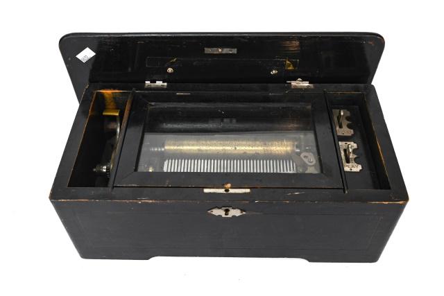 Antique Victorian Swiss Music Box: Antique Victorian Swiss Music Box. Hinged cover opening to glass covered jeweled movement with winding handle and levers controlling play, stop, repeat. 6 inches x 14 inches x 7 inches. Music box is i