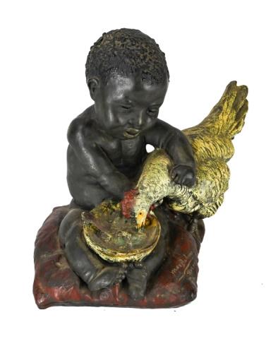 Max Bachmann Americana Resin Sculpture of a Boy: Max Bachmann Americana Resin Sculpture of a Boy and a Rooster.Measures 12 inches x 10 inches x 10 inches.