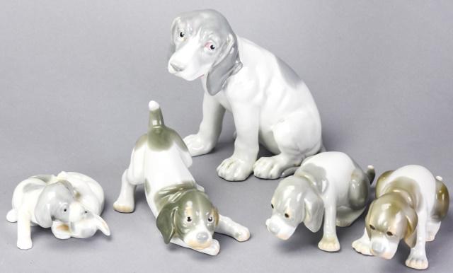Lot Porcelain Hound Dog Including Heubach: Lot Hand Painted Porcelain Hound Dog Figurines Including Heubach. Includes 5 figurines in various poses and sizes. Largest measures 6 inches high x 6.5 inches wide x 3.5 inches deep.