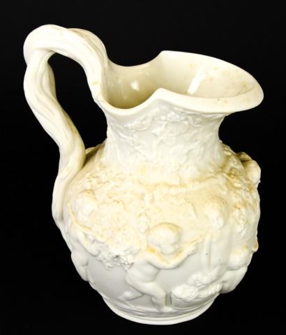 Antique Copeland Parian Relief Putti Motif Pitcher: Antique Copeland Parian Relief Putti Motif Pitcher. Relief moulded with a continuous band of putti amongst grapevine. Moulded factory mark to the base. Measures 8 inches high x 5.5 inches wide x 5 inc