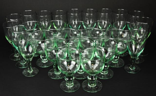 Collection Hand Blown Green Glass Stemware: Collection Hand Blown Green Glass Stemware. 29 items total. Includes wine glasses and 2 sizes of goblets. Wine glasses measure 7 inches x 3 inches in diameter. Larger goblets measure 6 inches x 4.25 i