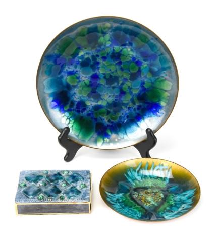 Edward Star & Georg Jensen Enamel Plates: Edward Star & Georg Jensen Enamel Plates. Enamel on copper plates featuring deep blue and green pattern. Larger plate is etched on back “Especially created for Georg Jensen.” Also includes matchbo