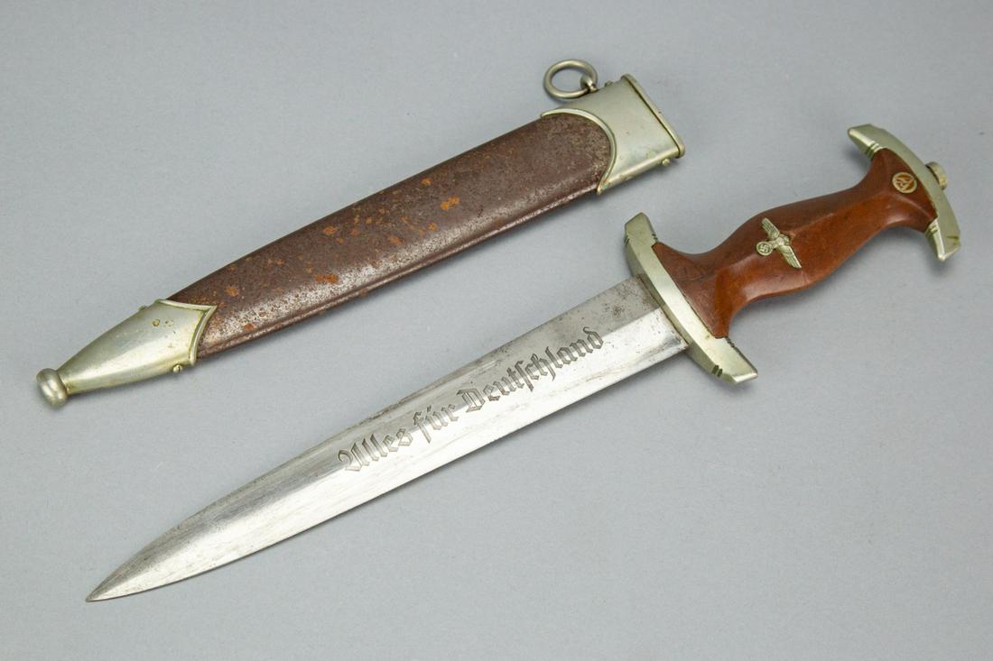 WWII Nazi German SA Dagger and Scabbard: WWII Nazi Kaufmann & Sohne Solingen German SA Dagger and Scabbard Blade Engraved Alles fur Deutschland Wood Handle.Measures 14.5 inches long.