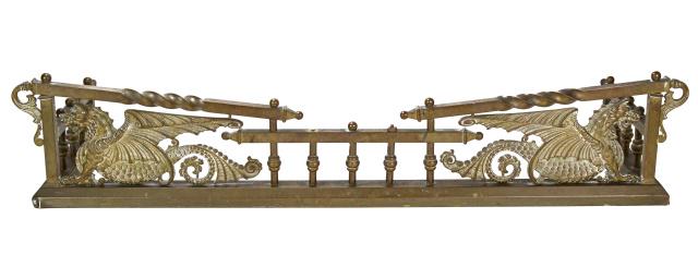 Antique Brass Iron Dragon Motif Fireplace Fender: Antique Brass Reinforced with Cast Iron Dragon Motif Fireplace Fender. Featuring Facing Dragons of Cast Brass. Measures 9 inches x 44 inches x 15 inches.