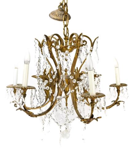 French Cast Gilt Bronze and Crystal Chandelier: French Cast Gilt Bronze and Crystal 6-Light Chandelier with Pendalogues in Acanthus Motif. 25 inches x 23 inches in diameter.
