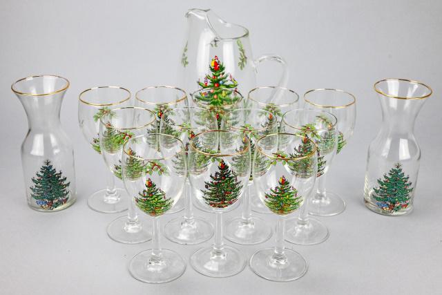 Collection Spode "Christmas Tree" Glassware: Collection Spode "Christmas Tree" Pattern Glassware Includes Pitcher, 2 Carafes, 11 Wine Glasses. There is some paint loss to the gold rims of the glasses. Pitcher measures 11 inches x 8 inches.