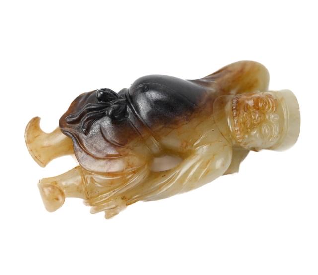 Tang Dynasty Carved Jade of a Sogdian Dancing: Tang Dynasty Carved Jade of a Sogdian Dancing. It is celadon color nephrite with brown and dark charcoal areas. 2 inches tall.