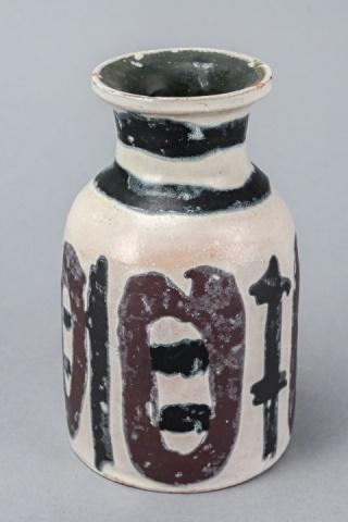 Livia Gorka Hungarian Retro Art Pottery Vase: Livia Gorka Hungarian Retro Art Pottery Vase in Black, Brown and Ivory. Some minor chipping to rim. 6 inches x 3 inches in diameter.