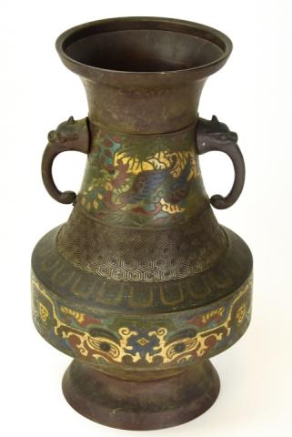 Chinese Bronze Footed Vase W Foo Dog Handles: Chinese Bronze Urn Form Footed Vase W Painted Enamel Champleve Design & Foo Dog Handles. Measures 11.75 inches high x 7 inches wide.