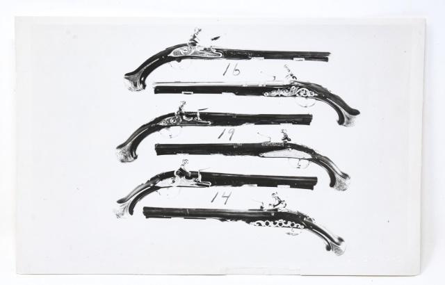 Andy Warhol Black & White Photograph of Guns: Andy Warhol Black & White Photograph of Guns. Black and white photograph of guns by Andy Warhol. Embossed with the artists' name in the lower right and stamped "Authenticated by The Estate of Andy War