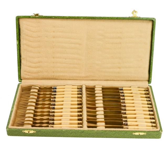 Set 24 Antique Gilt & Ivorine Fruit Knives Forks: Boxed Set of 24 Antique Gilt & Ivorine Handled Fruit Knives and Forks. Knives measure 6.5 inches long.