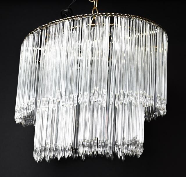 Mid C Modern Crystal 2 Tiered Icicle Chandelier: Mid C Modern Crystal 2 Tiered Icicle Chandelier. Round chandelier made up of crystal icicle vertical drops that are approximately 7 inches long. 13 inches x 16 inches in diameter.