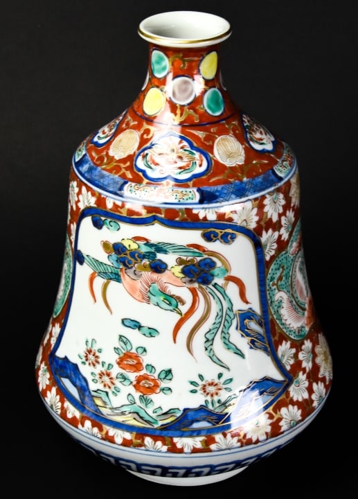 Japanese Hand Painted Imari Vase: Japanese Hand Painted Imari Vase. Marked on bottom. Measures 11.5 inches high x 8 inches wide.