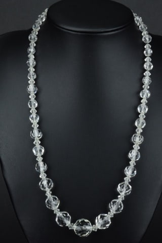 Antique Art Deco Faceted Rock Crystal Necklace: Antique Art Deco Faceted Rock Crystal Necklace. Graduated size rock crystal beads w spacers strung on chain. Measures 19 inches in length.