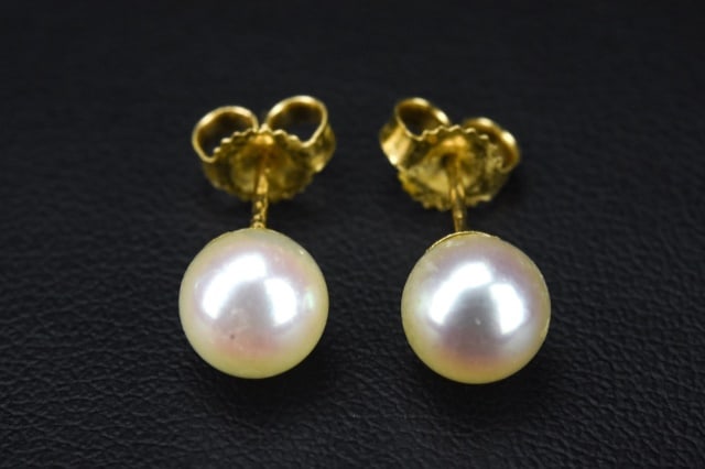 Pair of 14kt Yellow Gold Pearl Stud Earrings: Pair of 14kt Yellow Gold Pearl Stud Earrings. Each approximately .25 of an inch in width.