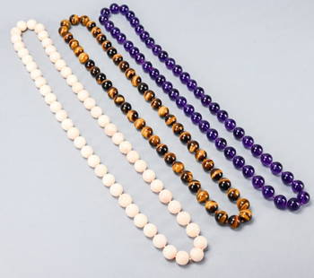 Collection of Beaded Strands Semi Precious Stones: Collection of Beaded Strands Semi Precious Stones Includes Quartz, Amethyst and Tiger's Eye.Stones are half inch in diameter, 18 inches long.