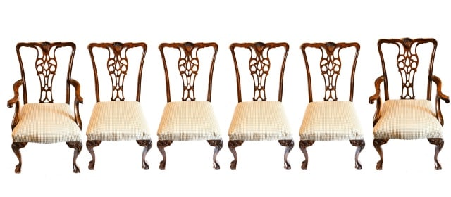 6 Antique Victorian Carved Mahogany Dining Chairs: Set of 6 Antique Victorian Hand Carved Custom Upholstered Mahogany Dining Chairs Cabriole Legs with Claw and Ball Feet. 2 with arm.Measures 39 inches x 24 inches x 20 inches.