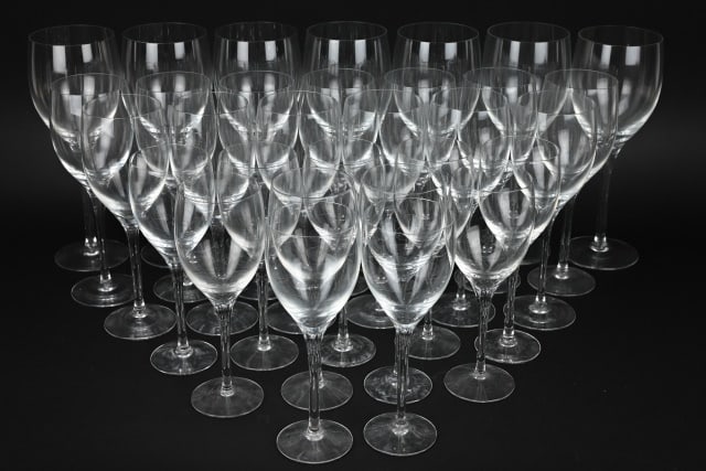 Orrefors Crystal Wine Glasses w Stems: Orrefors Crystal Wine Glasses w Stems. Includes approximately 7 red wine, 13 large white wine, 11 small white wine glasses. Red wine glass measures 9 inches x 3.5 inches.