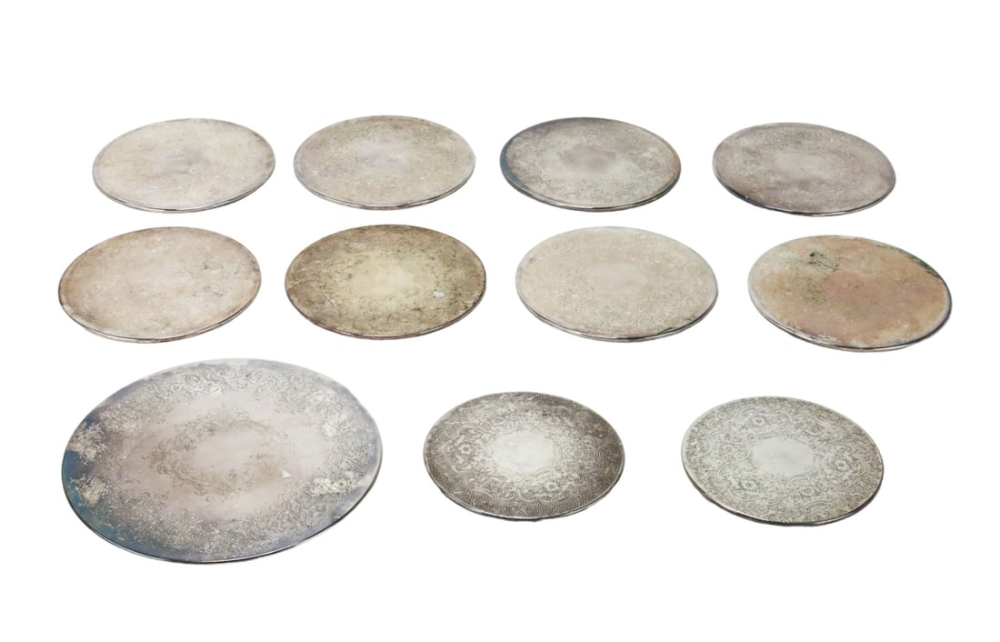 Collection 11 English Silver Plate Trivets: Collection 11 English Silver Plate Embossed Trivets, 8 for Dinner Plates in Original Boxes of 4. Largest measures 10 inches in diameter.