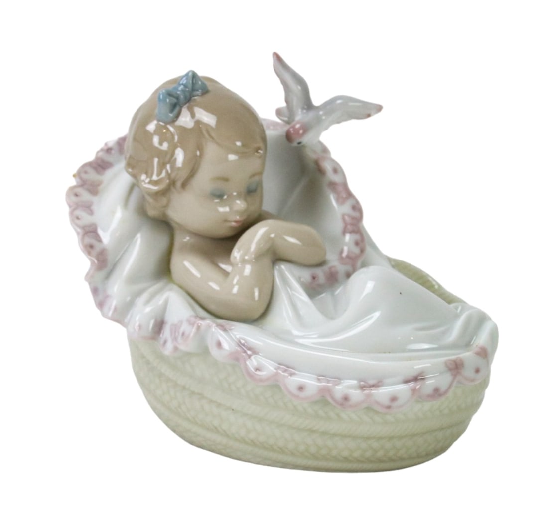 Lladro "Comforting Dreams" 6710 Porcelain Figurine: Lladro "Comforting Dreams" 6710 Porcelain Figurine.Measures 4 inches x 3 inches x 5 inches.